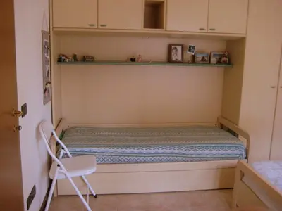 Letto o letti in una camera di RESIDENCE IPANEMA - WALTERIGATO Apartments SOLO PER FAMIGLIE