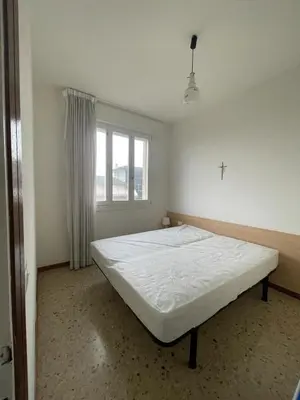 Letto o letti in una camera di RESIDENCE VELA - WALTERIGATO Apartments SOLO PER FAMIGLIE