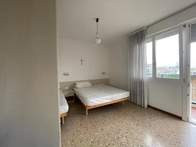 Letto o letti in una camera di RESIDENCE VELA - WALTERIGATO Apartments SOLO PER FAMIGLIE