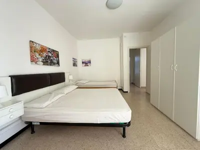 Letto o letti in una camera di RESIDENCE CENTRO COMMERCIALE - WALTERIGATO Apartments SOLO PER FAMIGLIE
