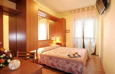 Letto o letti in una camera di Hotel Germania