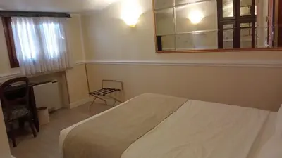 Letto o letti in una camera di Alloggi Arlecchino