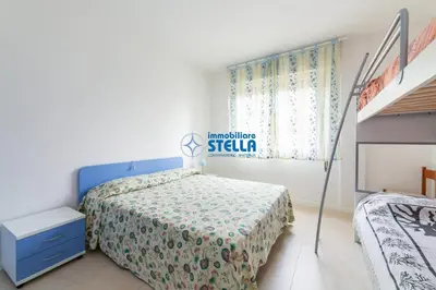 Letto o letti in una camera di Condominio Tritone
