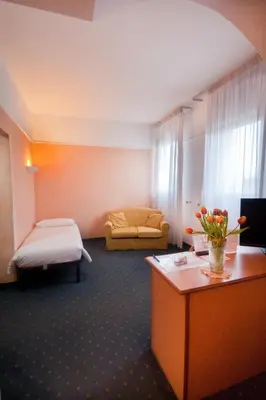Letto o letti in una camera di Hotel Le Sorgenti