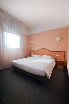 Letto o letti in una camera di Hotel Le Sorgenti