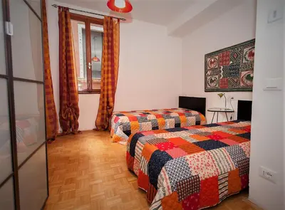 Letto o letti in una camera di Ca Rossa - Venezia