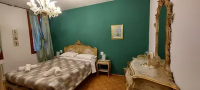 Letto o letti in una camera di Ca Rossa - Venezia