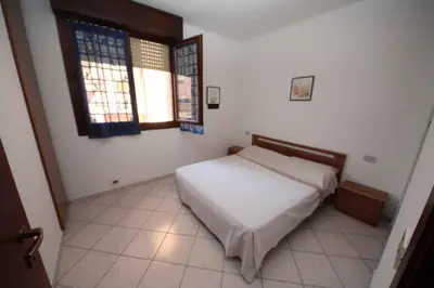 Letto o letti in una camera di Apartments in Rosolina Mare 33097