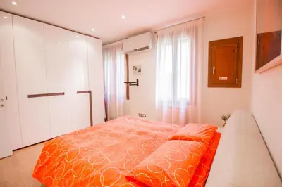 Letto o letti in una camera di Ca' Lunetta - 5' from St. Mark Square