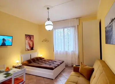 Letto o letti in una camera di La Casetta di Maria