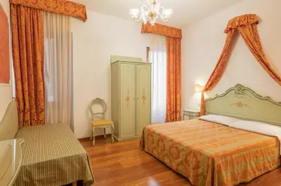 Letto o letti in una camera di Hotel al Sotoportego