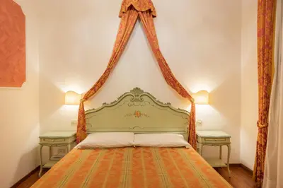 Letto o letti in una camera di Hotel al Sotoportego