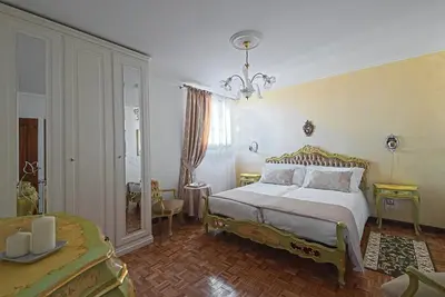 Letto o letti in una camera di VECCHIA FAVOLA HOUSE