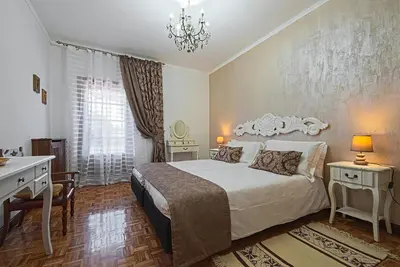 Letto o letti in una camera di VECCHIA FAVOLA HOUSE