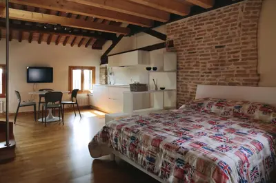 Letto o letti in una camera di Loft Mirano Due (Alloggi alla Campana)