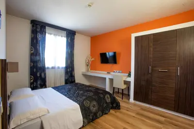 Letto o letti in una camera di Matrix Hotel & Residence