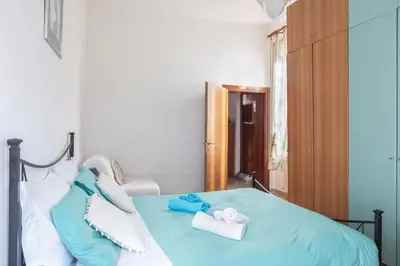 Letto o letti in una camera di CASA VACANZA LYUDMYLA