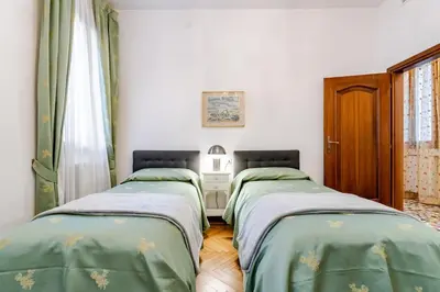 Letto o letti in una camera di Residenza Procuratie Due