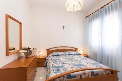 Letto o letti in una camera di Petite Maison