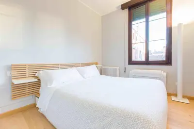 Letto o letti in una camera di CA CORTE NOVA design apartment with canal view
