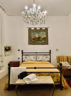 Letto o letti in una camera di B&B Ca' Dor