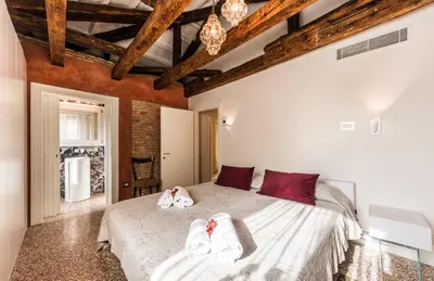 Letto o letti in una camera di Apartment Cà Brunilda-luxury penthouse with terrace