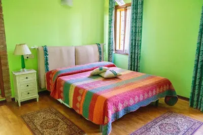 Letto o letti in una camera di Agriturismo Biologico La Buona Terra
