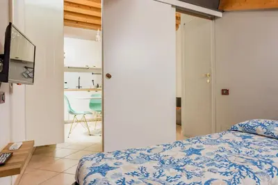 Letto o letti in una camera di La Bella Vita - Appartamenti Mimì & Cocò