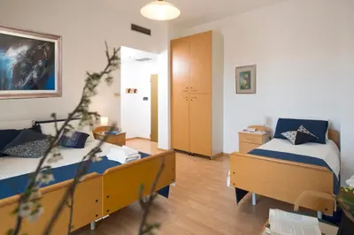 Letto o letti in una camera di Casa Al Carmine