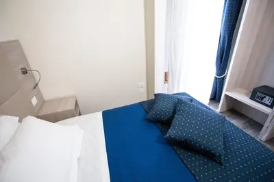 Letto o letti in una camera di HOME HOTEL
