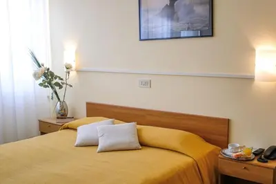 Letto o letti in una camera di Hotel Santa Lucia