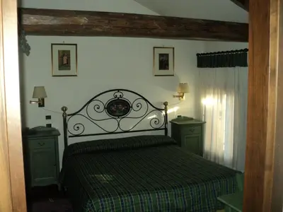 Letto o letti in una camera di Albergo La Bersagliera