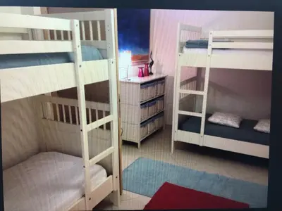 Letto o letti in una camera di Jesolo pineta oasi verde ,spiaggia e mare