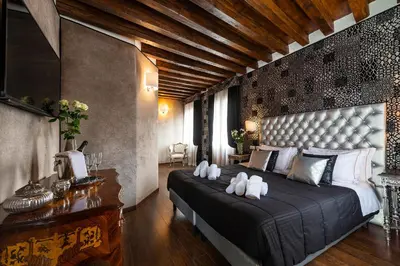 Letto o letti in una camera di Domus Superior