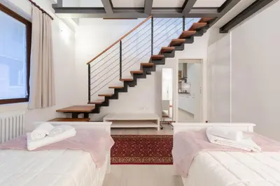 Letto o letti in una camera di Ca' del Pozzo Loft Apartment