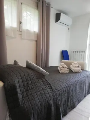 Letto o letti in una camera di Appartamento Le Magnolie 2