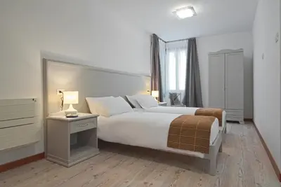Letto o letti in una camera di Palazzetto Canossa