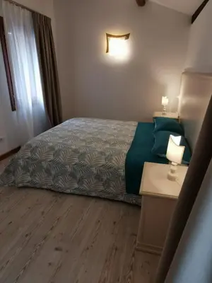Letto o letti in una camera di Palazzetto Canossa