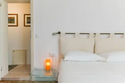 Letto o letti in una camera di Fortuny Loft
