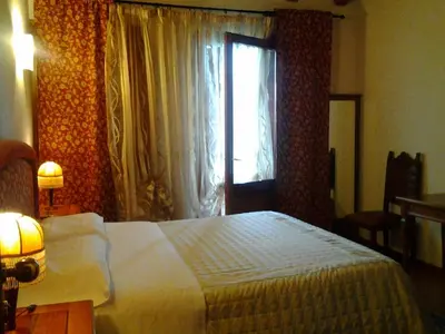 Letto o letti in una camera di Agriturismo MELO IN FIORE con camere e colazioni nella zona del Prosecco DOCG Asolo