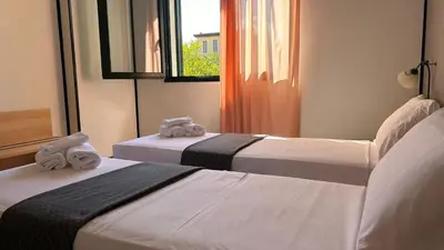 Letto o letti in una camera di Hotel Gran Delta di ALBA-INVEST srl