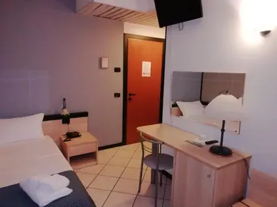 Letto o letti in una camera di Hotel Gran Delta di ALBA-INVEST srl
