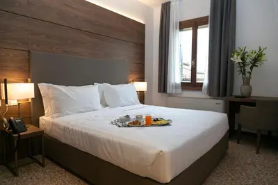 Letto o letti in una camera di Palazzo Scamozzi
