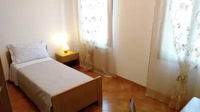 Letto o letti in una camera di Casa Giulia