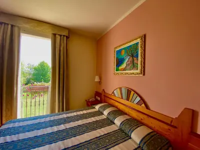 Letto o letti in una camera di Cà Rocca Relais