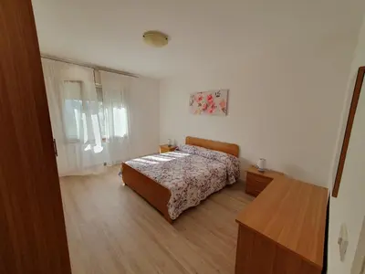 Letto o letti in una camera di Meneghin House