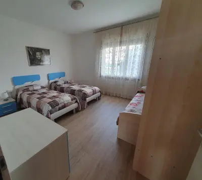Letto o letti in una camera di Meneghin House