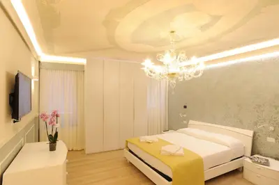 Letto o letti in una camera di CA' XXII MARZO BOUTIQUE