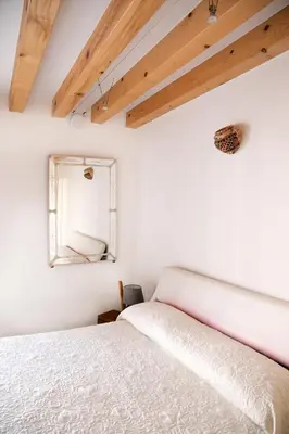 Letto o letti in una camera di Giardino in laguna