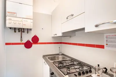 Cucina o angolo cottura di GuestHost - Prato della Valle Red & Blu Studios